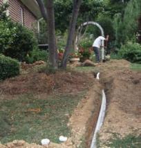 one of our irrigation repair in Miami techs is installing a new line