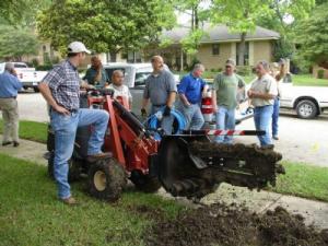 our Miami irrigation repair team are digging a trench for a new system installation